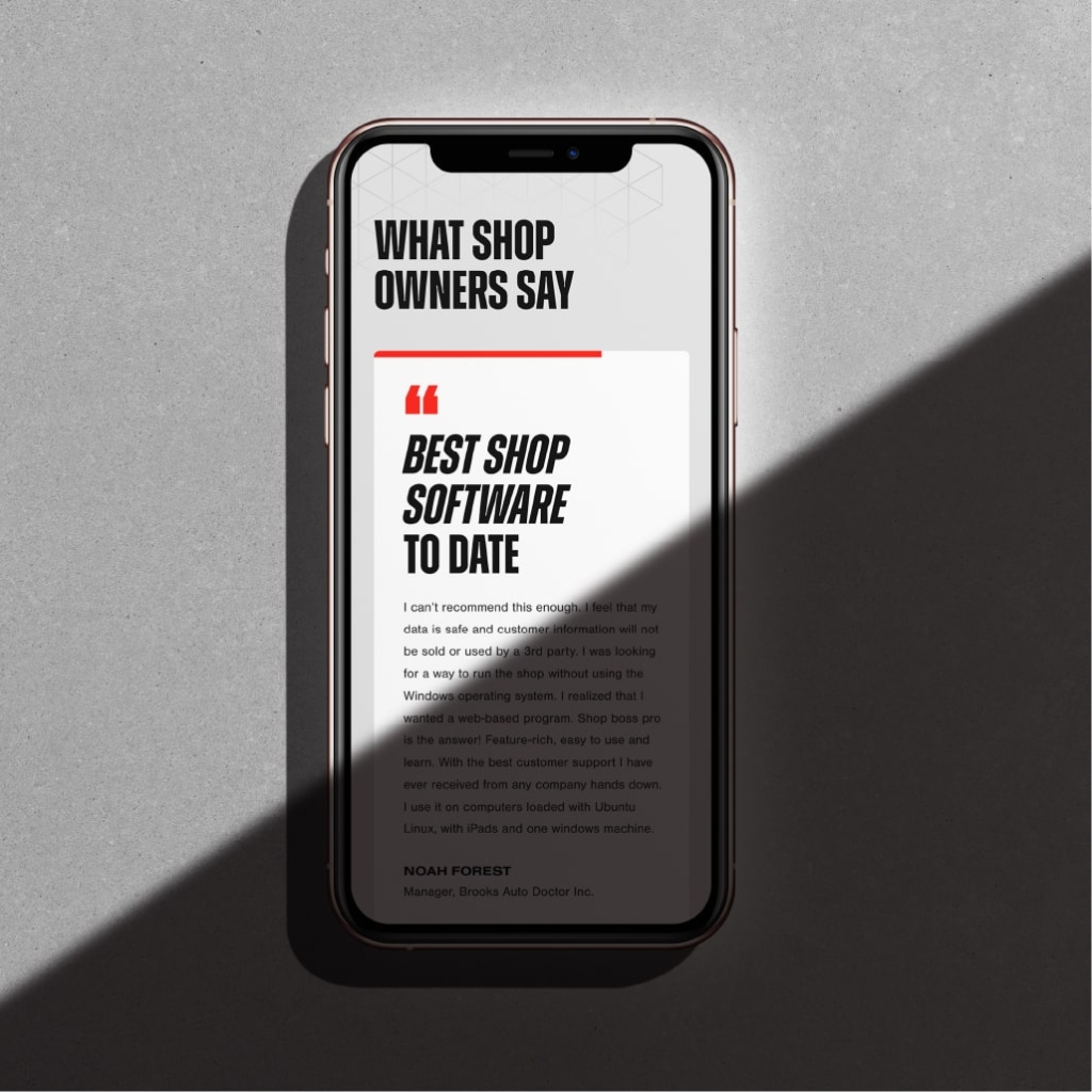 A smartphone displaying the Shop Boss website design.